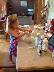 L loves to help me "cook" lotion.